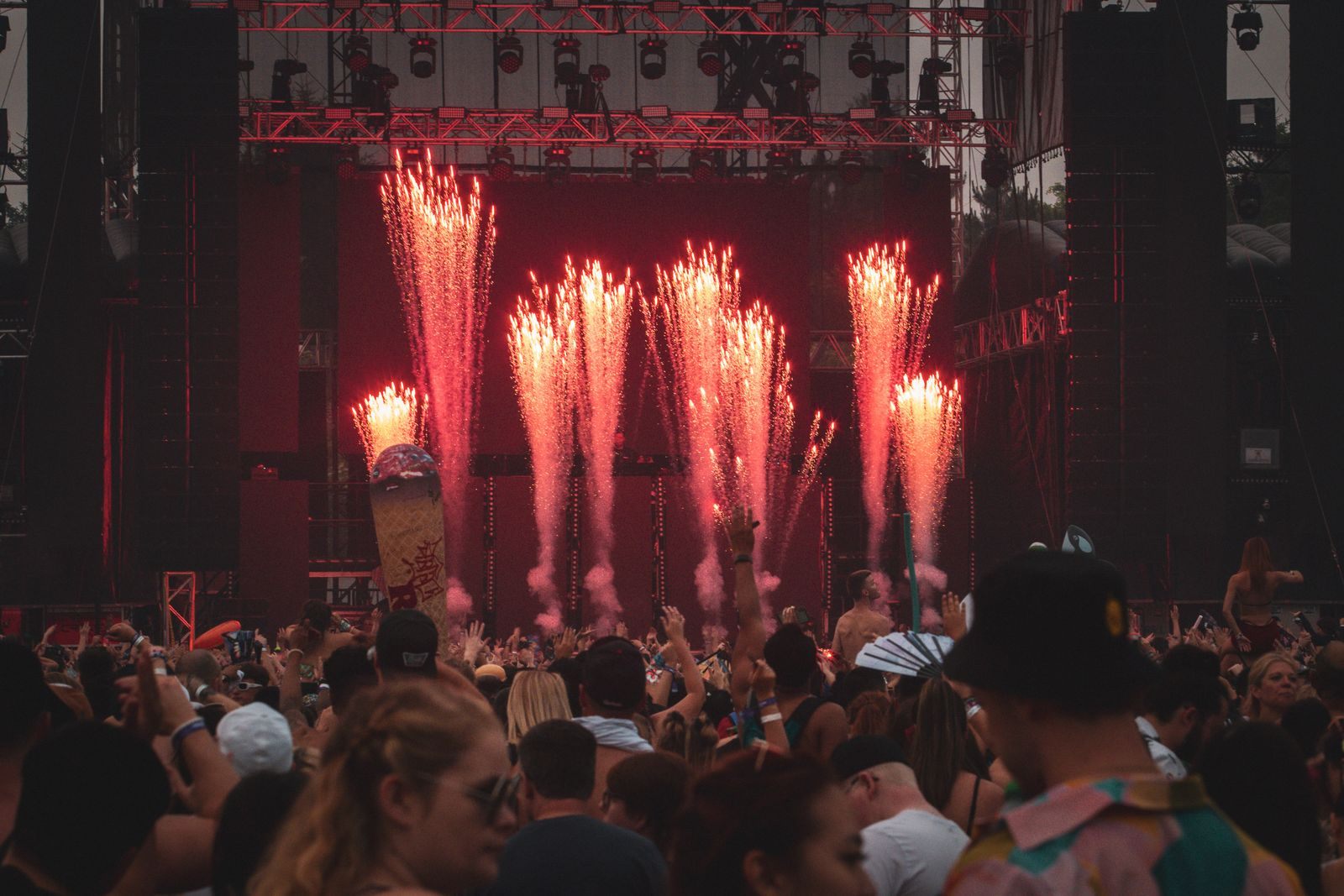 Concert stage with fireworks over a cheering crowd, the spirit of theme cruises 2027